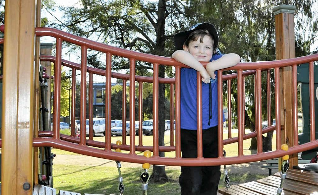 Enjoying a warm day in the park after such cold nights is 4-year-old Aaron Savins.